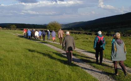 people walking to site